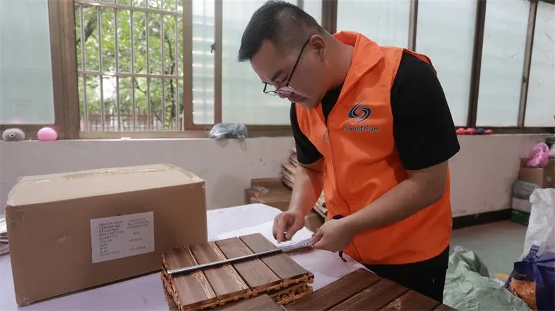 Goodcantrading inspector checking a customer order against the approved specification before shipment in Yiwu, China