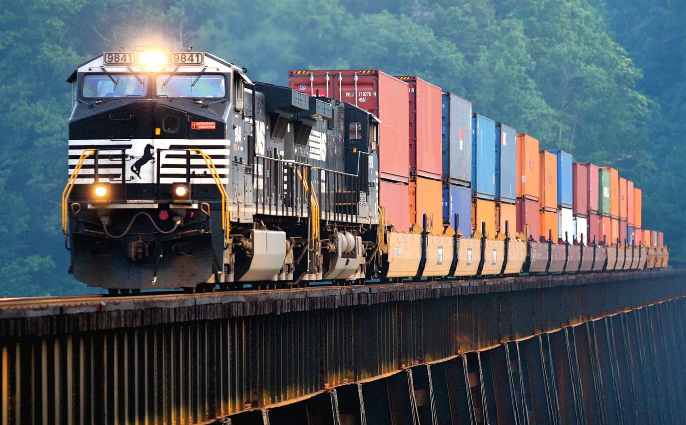 Freight train carrying containers on the China to Europe rail corridor used for mid priority shipments